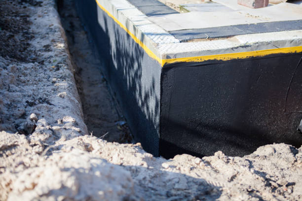 Professional Emergency Waterproofing technician working in North Baltimore, OH
